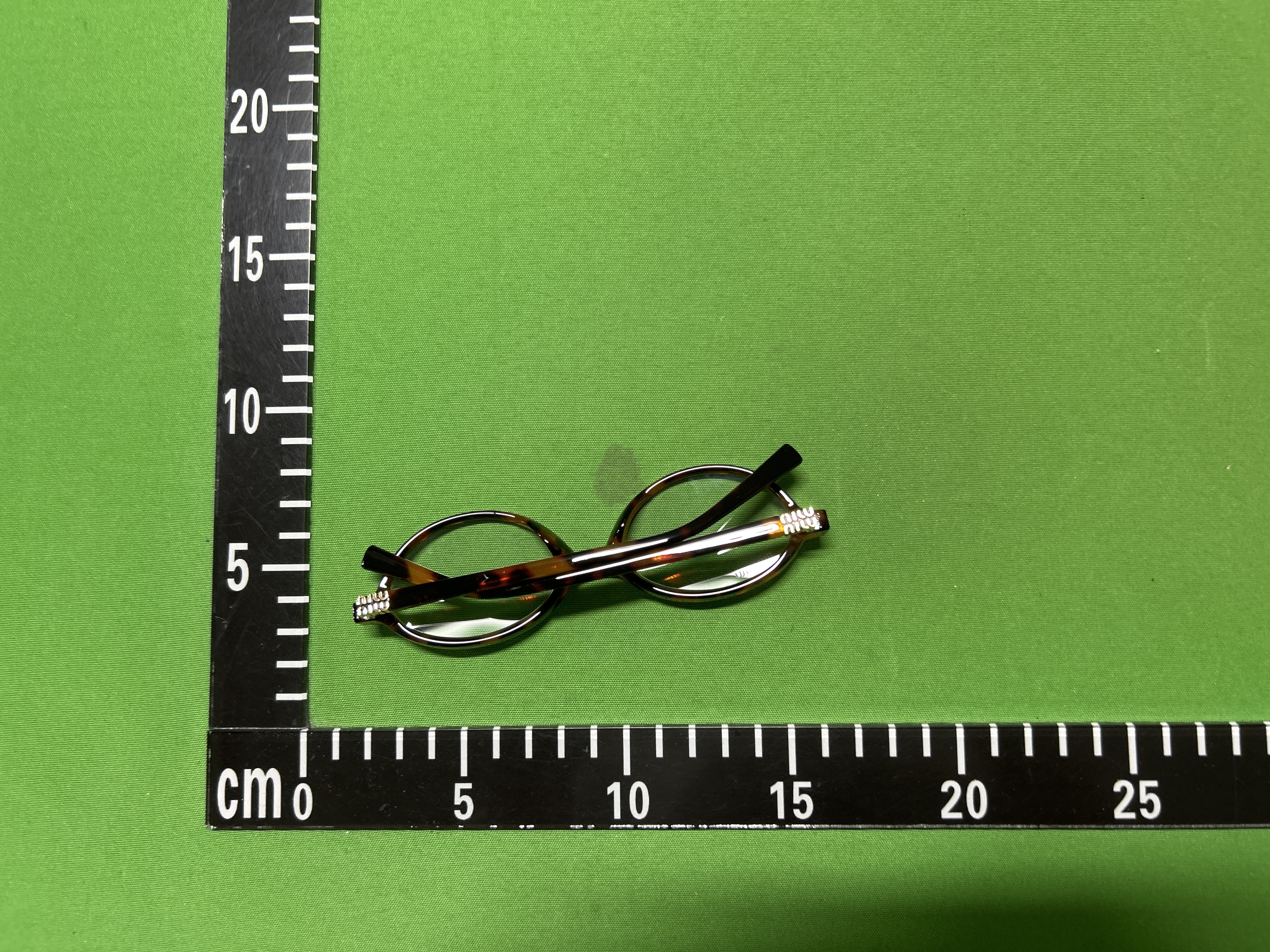 Foto QC 5 de Miu Miu Cat-Eye Acetate Eyeglasses Havana (MU03UV-7S01O1)