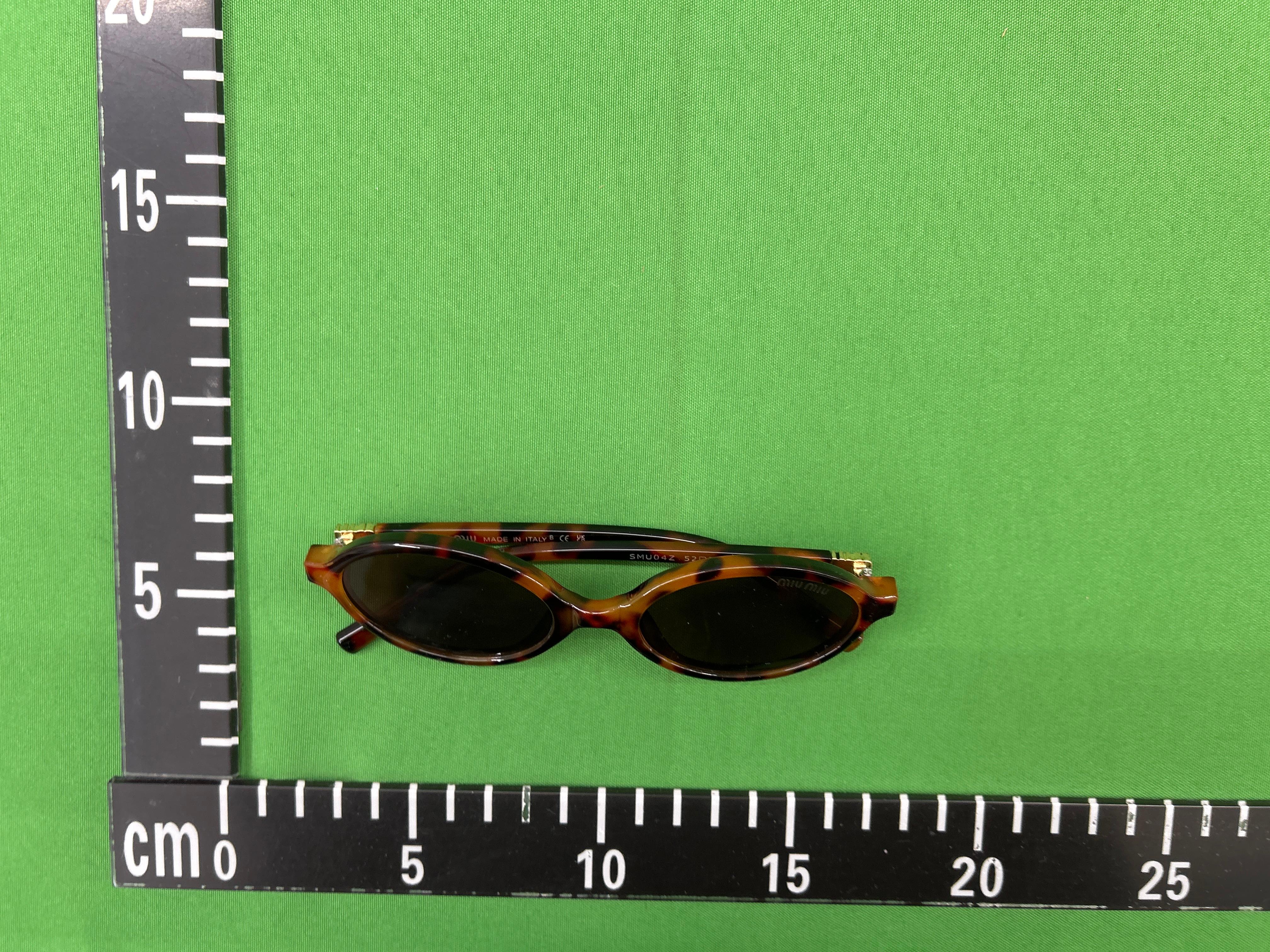 Foto QC 3 de Miu Miu Oval-Frame Acetate Sunglasses Havana Brown (SMU04P)