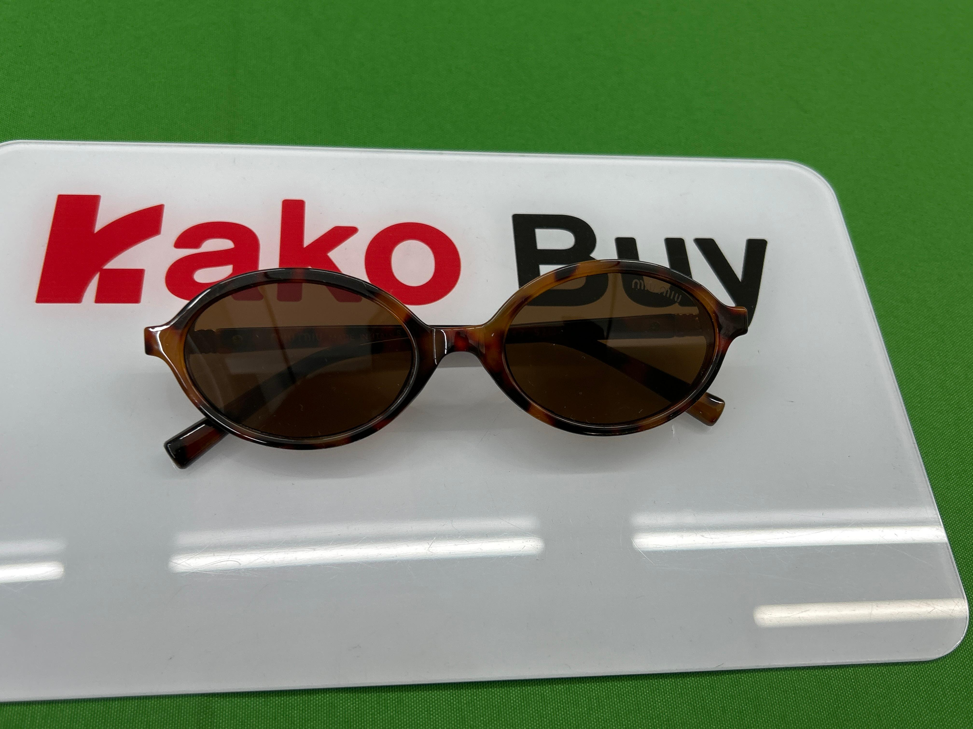 Foto QC 5 de Miu Miu Oval-Frame Acetate Sunglasses Havana Brown (SMU04P)