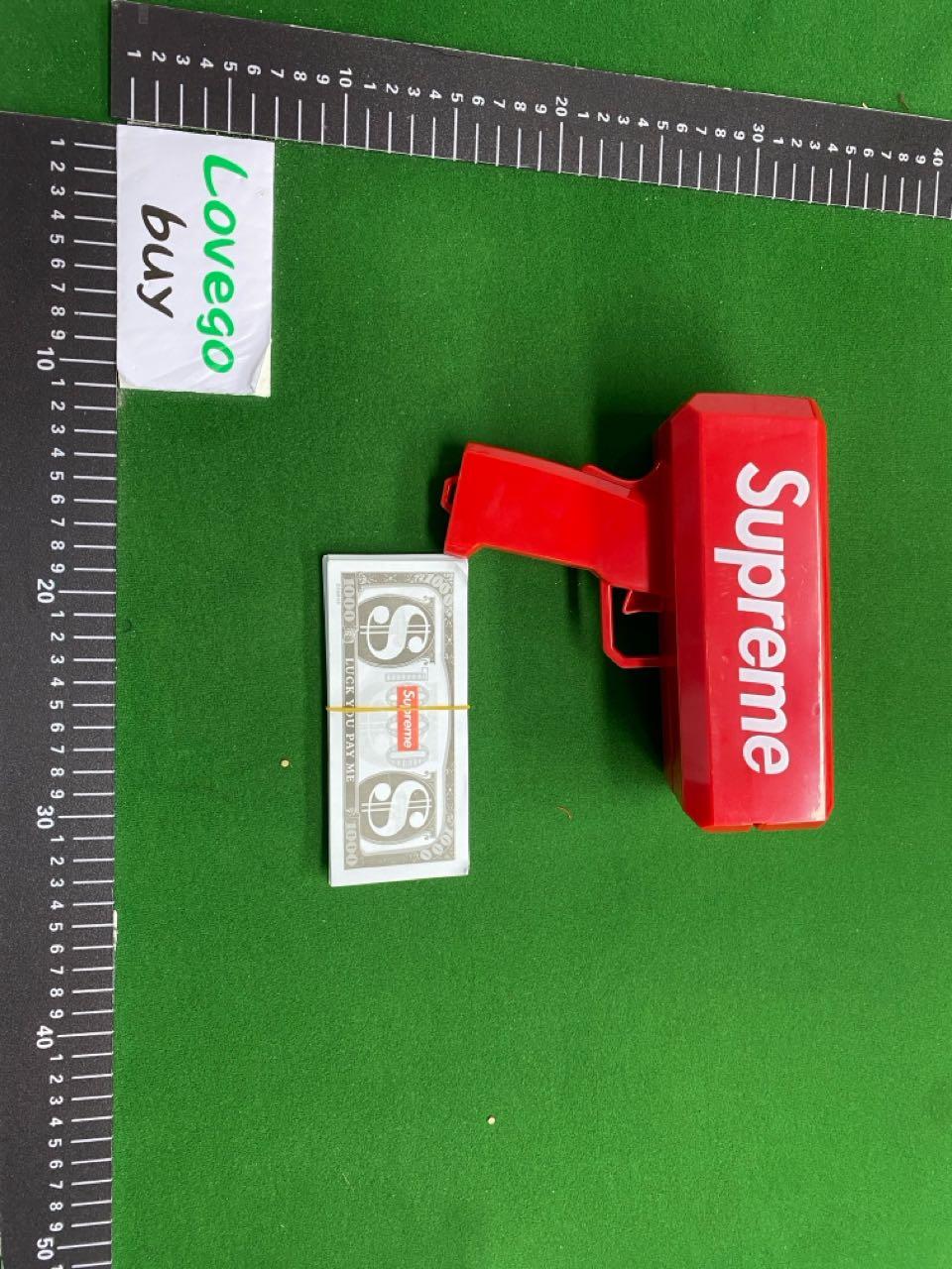 Foto QC 4 de Supreme Cash Cannon Red Plastic Money Gun