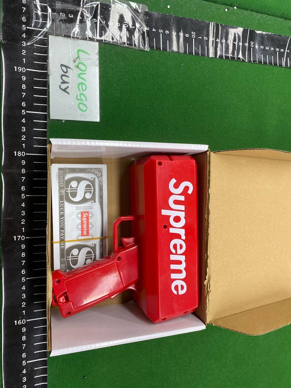 Foto QC 7 de Supreme Cash Cannon Red Plastic Money Gun
