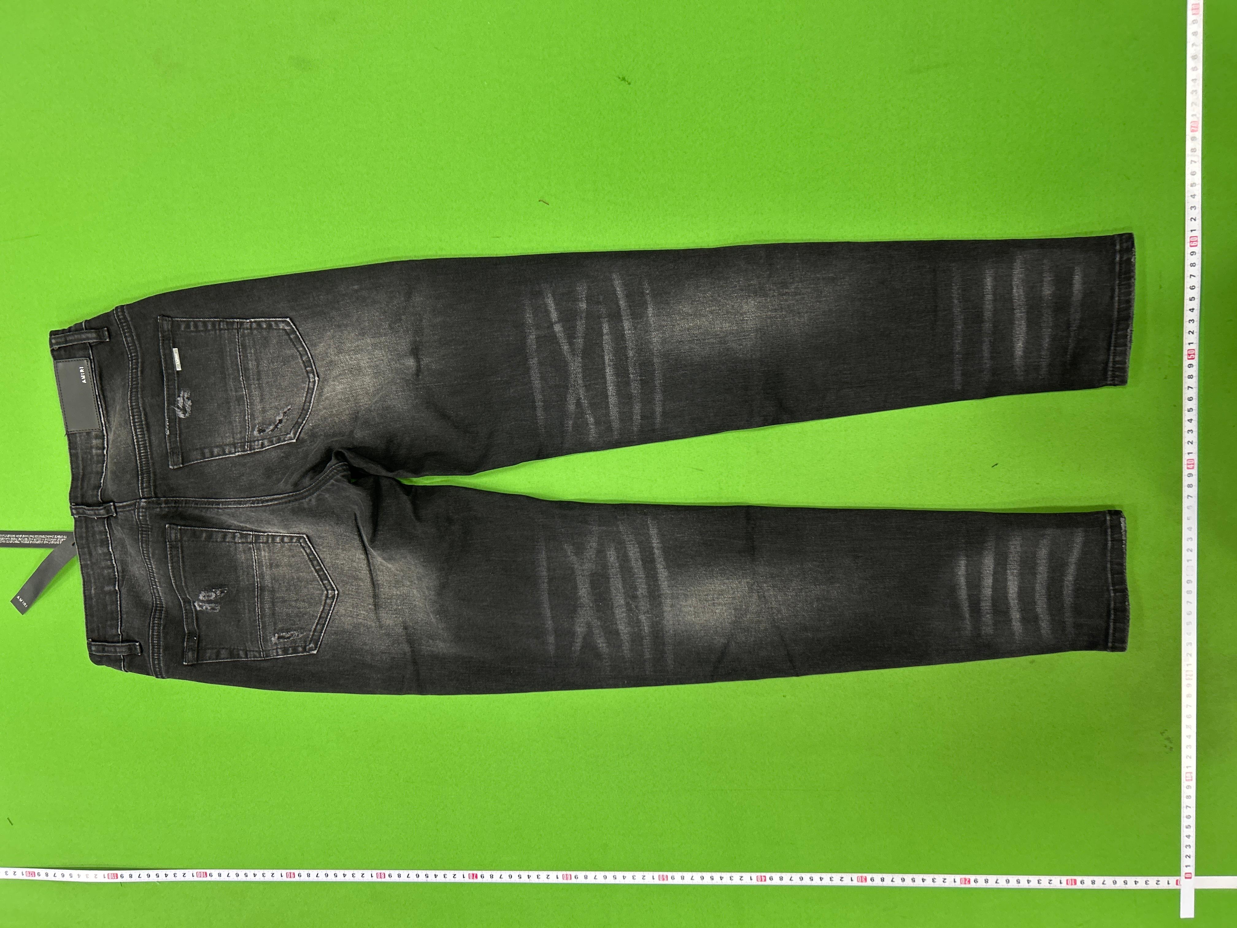 Foto QC 8 de Amiri Jeans Distressed Light Wash