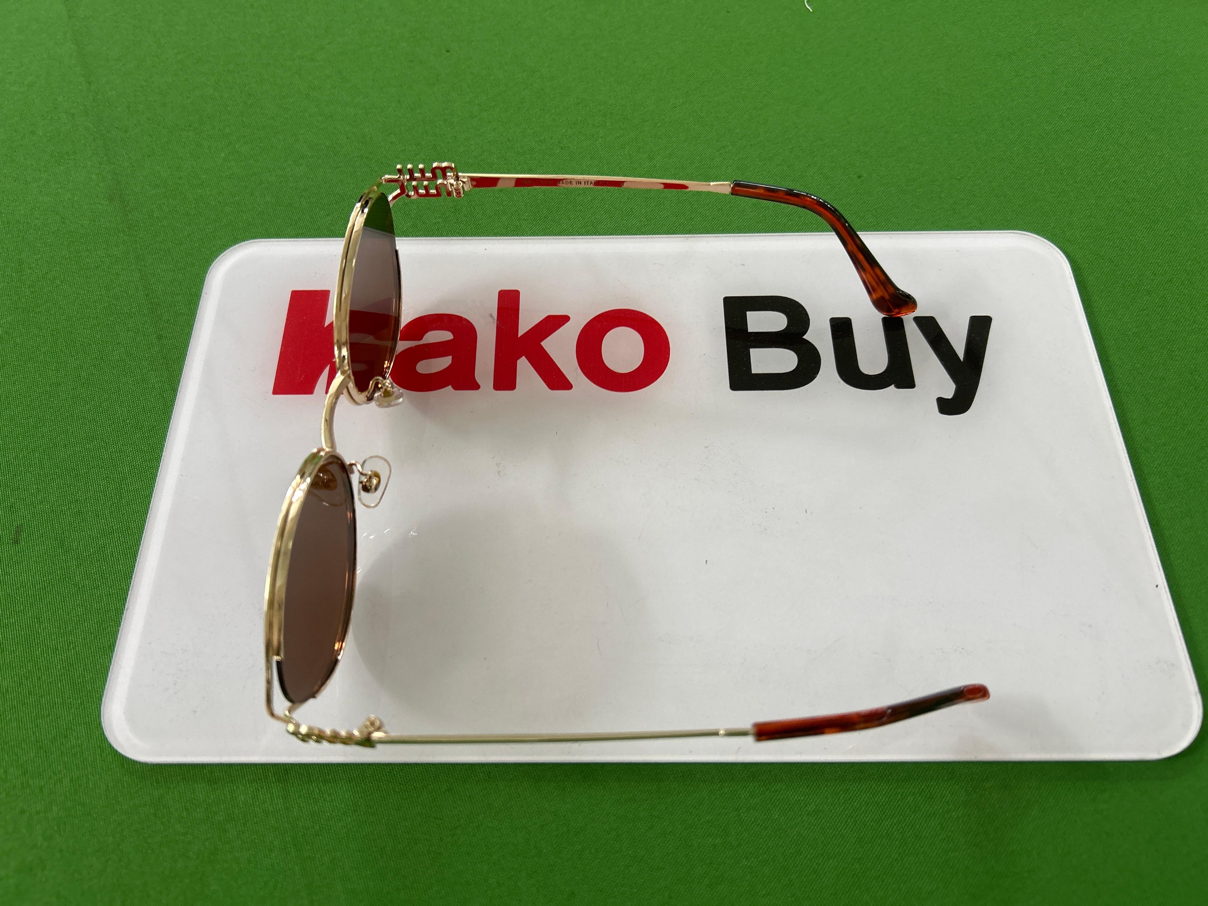 Foto QC 5 de Miu Miu Oval-Frame Metal Sunglasses Gold Brown (MU52SS)